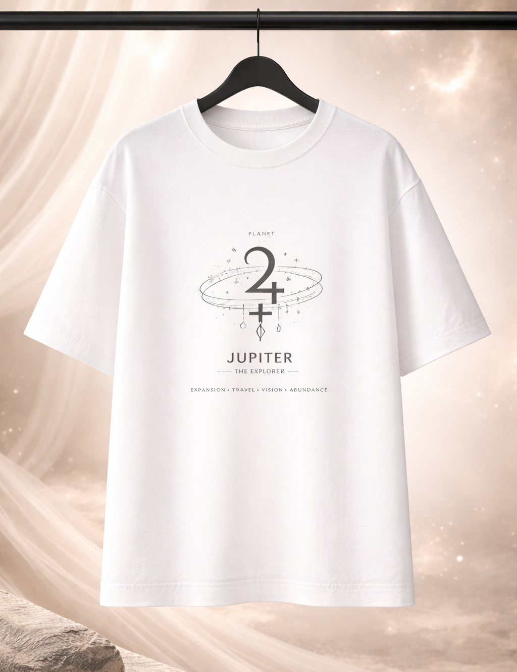 White t-shirt with Jupiter graphic design on a hanger against a soft, neutral background