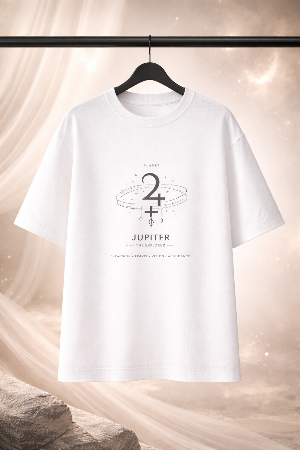 White t-shirt with Jupiter graphic design on a hanger against a soft, neutral background