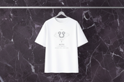 White t-shirt with a logo and text on a hanger against a light gray background