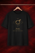 Black t-shirt with gold graphic design on a dark red background